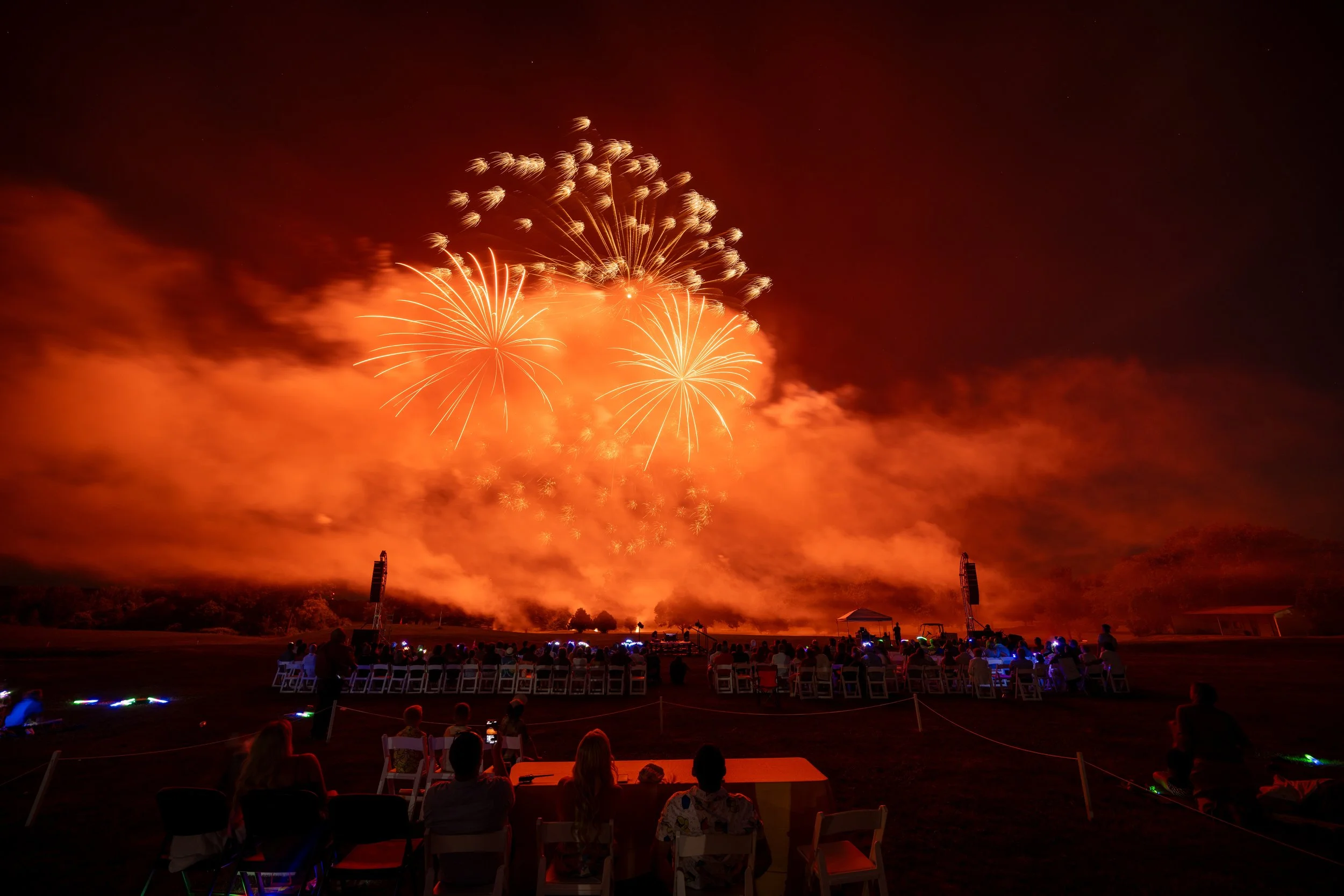 Fireworks over the water at Sparks of Giving